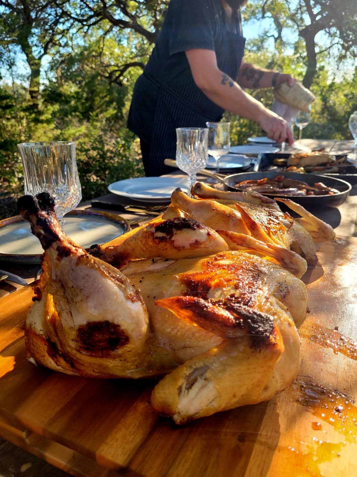 Roast chicken on the board while Alfie serves at the table