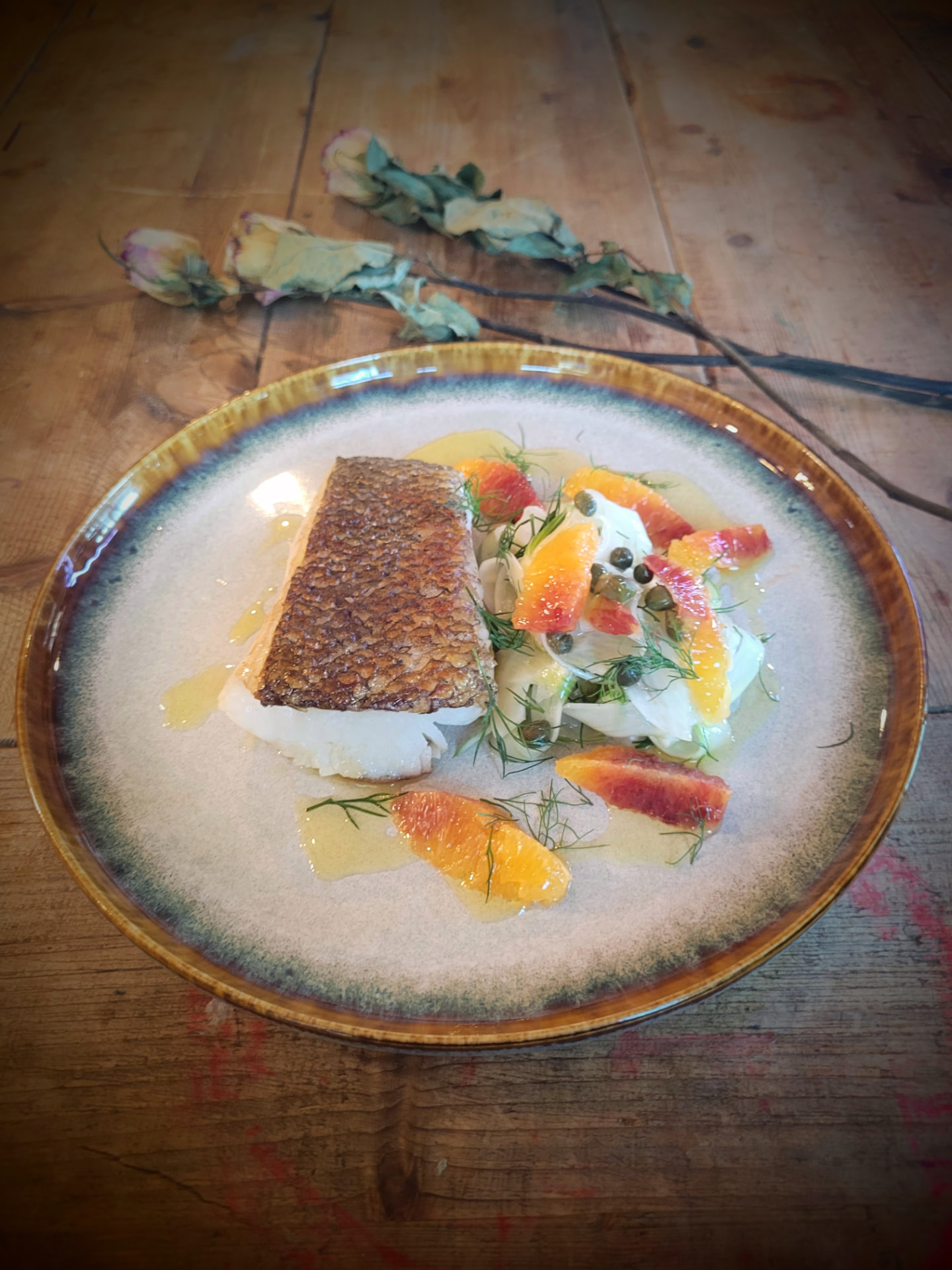 Sea bass with blood orange, fennel and capers