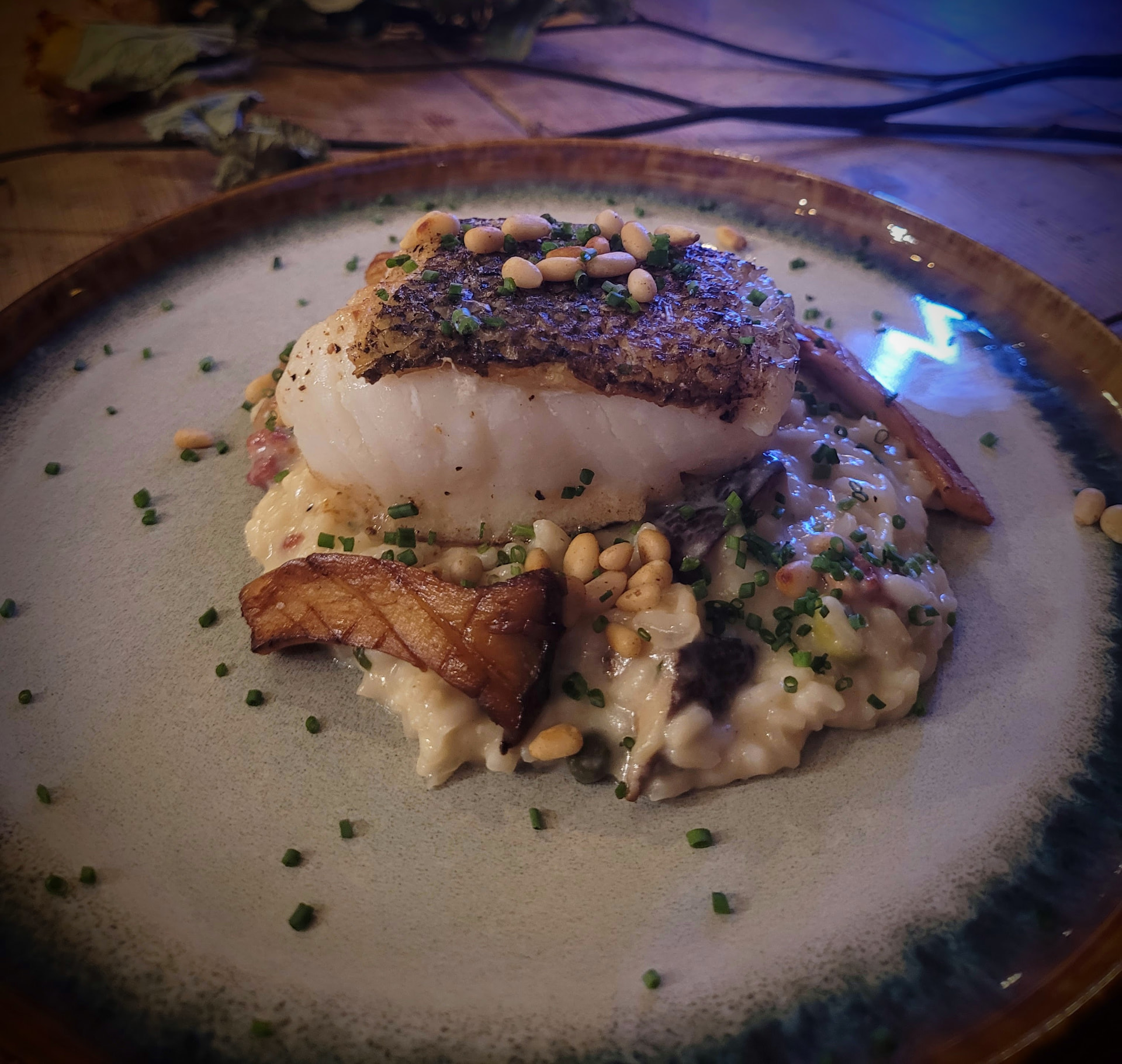 Roast cod on mushroom risotto with pine nuts